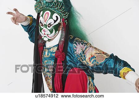 Portrait of a male Chinese opera performer standing on one leg View Large Photo Image Stock Image - Portrait of a male Chinese opera performer standing on one leg. Fotosearch