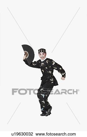 Portrait of a male Chinese opera performer holding a fan View Large Photo Image Stock Image - Portrait of a male Chinese opera performer holding a fan. Fotosearch