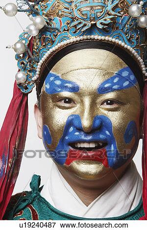 Stock Photo - Portrait of a male Chinese opera performer smiling. Fotosearch