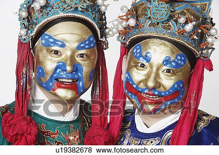 Stock Photo - Portrait of two male Chinese opera performers smiling. Fotosearch