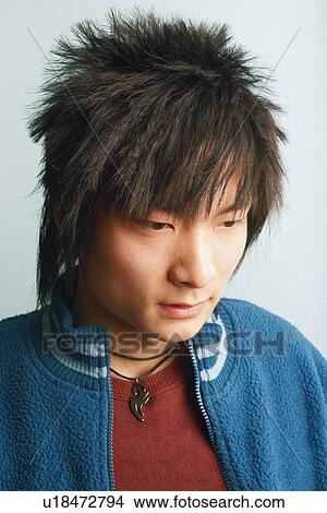 Picture - Close-up of a young man looking down. Fotosearch