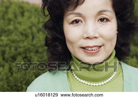 Stock Photo - Portrait of a mature woman smiling. Fotosearch