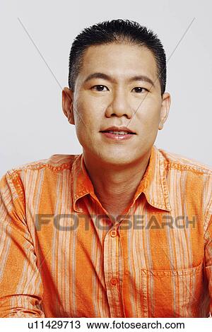 Stock Image - Portrait of a mid adult man smiling. Fotosearch