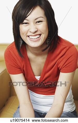 Picture - Portrait of a young woman smiling. Fotosearch
