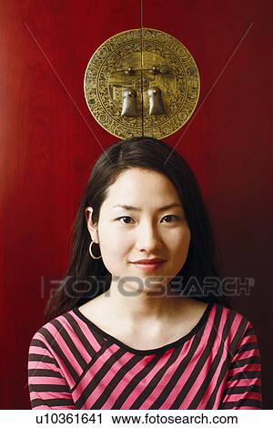 Portrait of a young woman smiling View Large Photo Image Stock Image - Portrait of a young woman smiling. Fotosearch