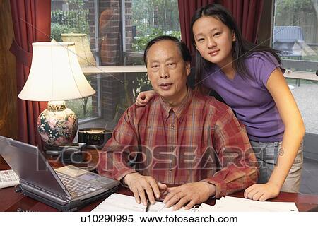 Stock Photography - Close-up of a grandfather and his granddaughter. Fotosearch