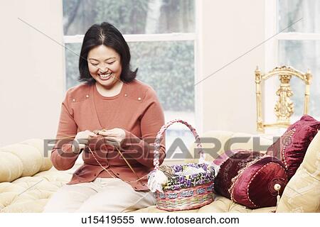 Stock Photography - Close-up of a mature woman knitting. Fotosearch