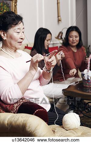 Close-up of a senior woman knitting View Large Photo Image Stock Photograph - Close-up of a senior woman knitting. Fotosearch