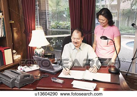 High angle view of a senior man talking to a mature woman View Large Photo Image Stock Image - High angle view of a senior man talking to a mature woman. Fotosearch