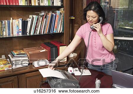 Mature woman talking on the telephone View Large Photo Image Stock Photograph - Mature woman talking on the telephone. Fotosearch