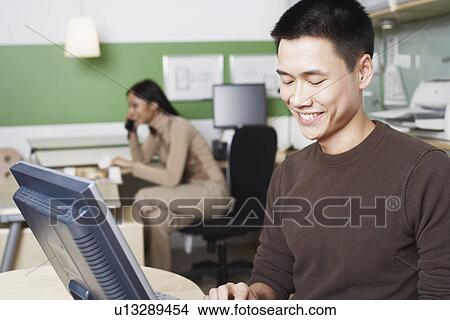 Close-up of a businessman using a computer View Large Photo Image Picture - Close-up of a businessman using a computer. Fotosearch