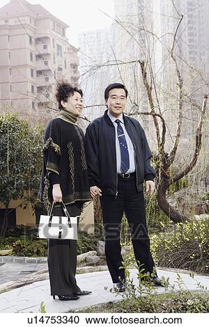 Stock Image - Portrait of a mature couple holding hands. Fotosearch