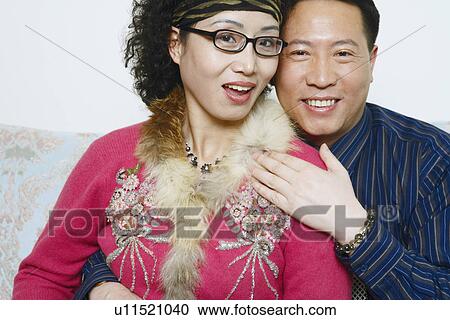 Stock Image - Portrait of a mature couple smiling. Fotosearch