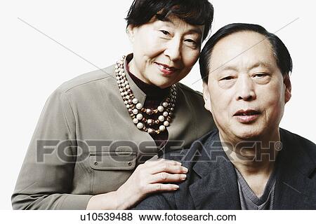 Portrait of a mature couple smiling View Large Photo Image Stock Photo - Portrait of a mature couple smiling. Fotosearch