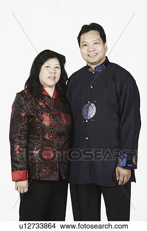 Picture - Portrait of a mature couple standing together smiling. Fotosearch