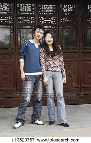 Stock Photo - Portrait of a young couple smiling. Fotosearch