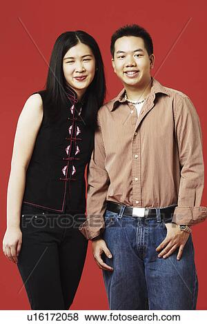 Stock Photo - Portrait of a young couple smiling. Fotosearch