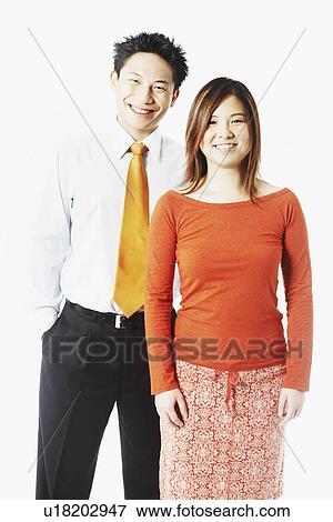 Stock Photo - Portrait of a young couple smiling. Fotosearch