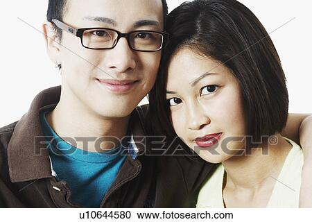 Portrait of a young man embracing a young woman View Large Photo Image Stock Image - Portrait of a young man embracing a young woman. Fotosearch