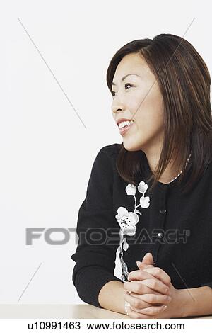 Stock Image - Close-up of a businesswoman smiling. Fotosearch