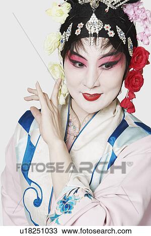 Stock Image - Mature woman wearing traditional clothing. Fotosearch