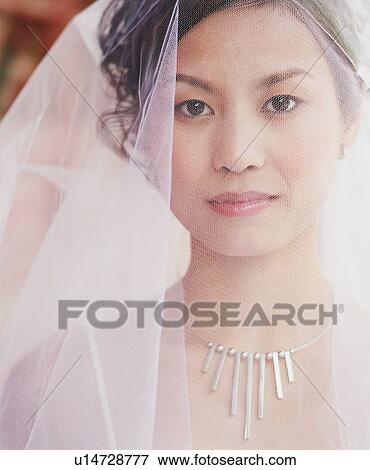 Portrait of a young woman in the wedding dress View Large Photo Image Stock Photo - Portrait of a young woman in the wedding dress. Fotosearch