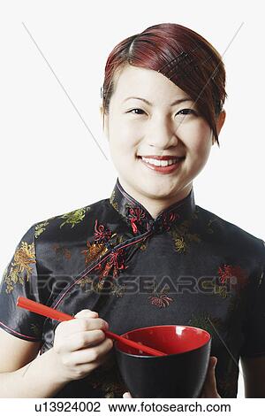 Stock Image - Portrait of a young woman smiling. Fotosearch