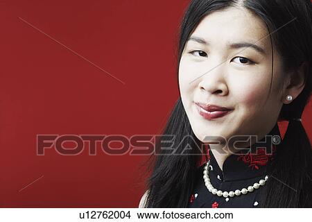 Picture - Portrait of a young woman smiling. Fotosearch