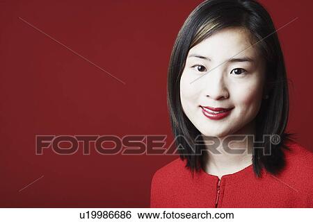 Stock Photograph - Portrait of a young woman smiling. Fotosearch