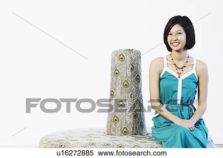 Portrait of a young woman smiling View Large Photo Image Stock Photography - Portrait of a young woman smiling. Fotosearch
