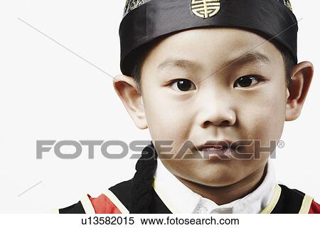 Stock Photography - Portrait of a boy thinking. Fotosearch