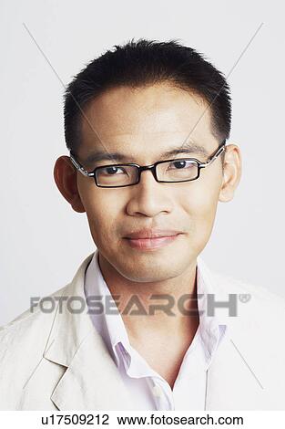 Portrait of a businessman smiling View Large Photo Image Stock Image - Portrait of a businessman smiling. Fotosearch
