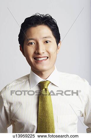 Stock Photography - Portrait of a businessman smiling. Fotosearch