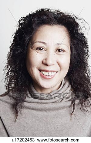 Stock Image - Portrait of a businesswoman smiling. Fotosearch
