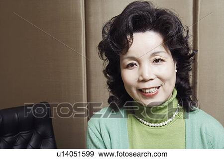 Portrait of a businesswoman smiling View Large Photo Image Stock Photo - Portrait of a businesswoman smiling. Fotosearch