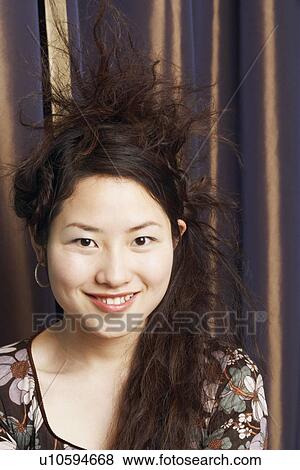 Stock Photo - Portrait of a teenage girl smiling. Fotosearch