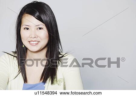 Picture - Portrait of a young woman smiling. Fotosearch