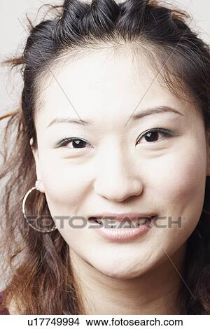 Picture - Portrait of a young woman smiling. Fotosearch