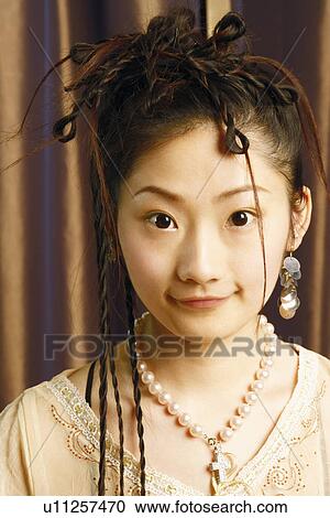 Portrait of a young woman smiling View Large Photo Image Stock Image - Portrait of a young woman smiling. Fotosearch
