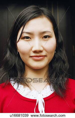 Portrait of a young woman smiling View Large Photo Image Stock Photo - Portrait of a young woman smiling. Fotosearch