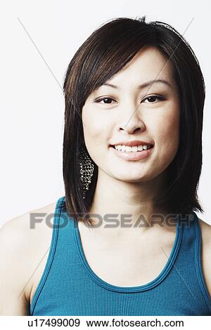 Stock Photo - Portrait of a young woman smiling. Fotosearch