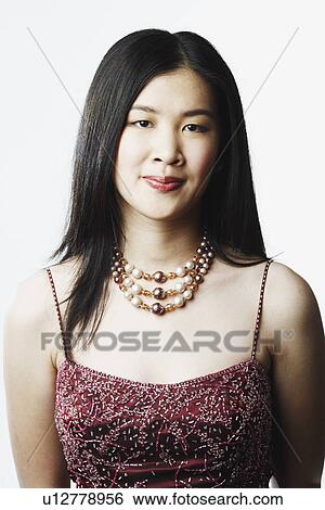 Portrait of a young woman smiling View Large Photo Image Stock Photograph - Portrait of a young woman smiling. Fotosearch