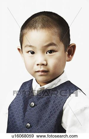 Portrait of a boy looking serious View Large Photo Image Stock Photo - Portrait of a boy looking serious. Fotosearch