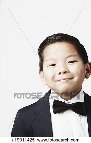 Stock Photography - Portrait of a boy smiling. Fotosearch