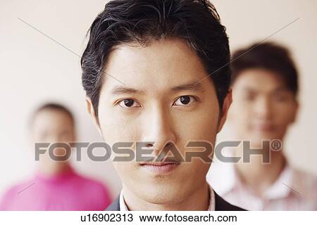 Stock Image - Portrait of a businessman looking serious. Fotosearch