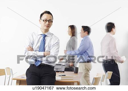 Portrait of a businessman looking serious View Large Photo Image Stock Photo - Portrait of a businessman looking serious. Fotosearch