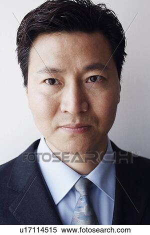 Stock Photography - Portrait of a businessman looking serious. Fotosearch