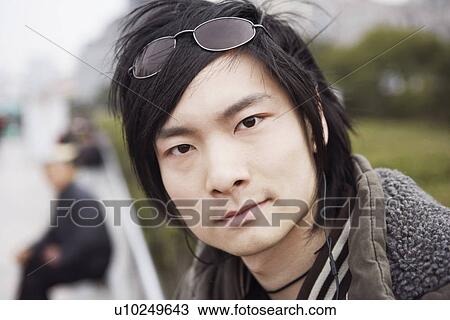Portrait of a young man looking serious View Large Photo Image Stock Image - Portrait of a young man looking serious. Fotosearch