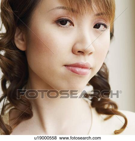 Portrait of a young woman looking serious View Large Photo Image Stock Photo - Portrait of a young woman looking serious. Fotosearch