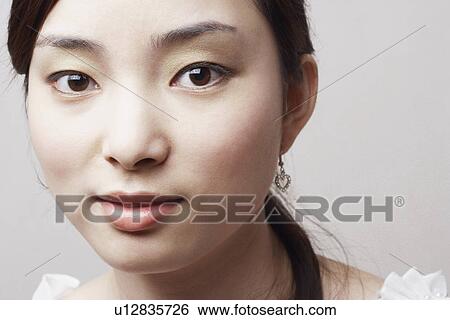 Stock Photograph - Portrait of a young woman. Fotosearch